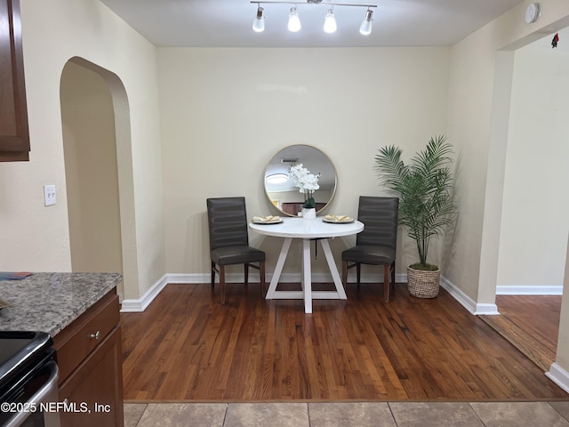1612 Greenridge Rd, Jacksonville, FL 32207 - dining room with arched walkways and wood finished floors