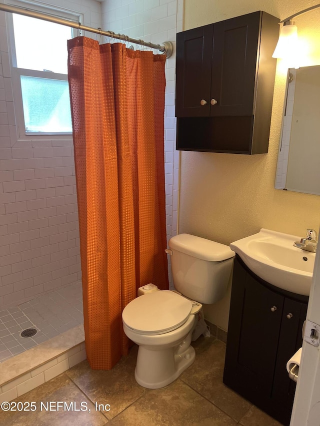 1612 Greenridge Rd, Jacksonville, FL 32207 - full bath featuring vanity, tiled shower, and tile patterned floors