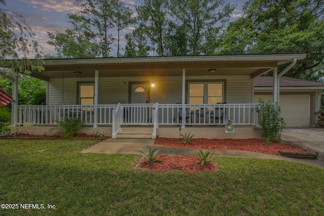 2051 Cornell Rd, Middleburg, FL 32068 - view of front of house with a porch, an attached garage, a lawn, and driveway