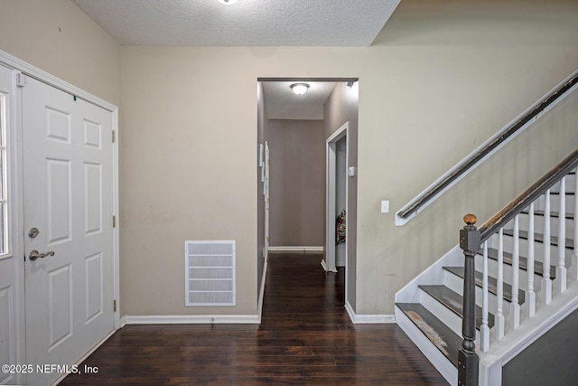 1341 River City St, Saint Augustine, FL 32092 - entryway with a textured ceiling, wood finished floors, and stairs