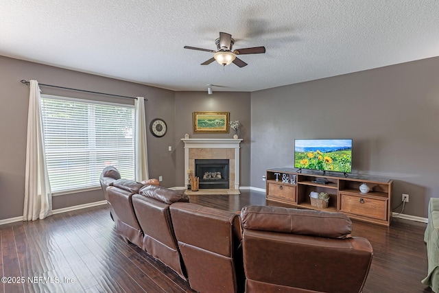 1341 River City St, Saint Augustine, FL 32092 - living area featuring ceiling fan, a fireplace, a textured ceiling, and dark wood-style flooring
