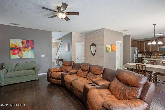 1341 River City St, Saint Augustine, FL 32092 - living area featuring wood finished floors, ceiling fan, stairs, a chandelier, and wooden walls