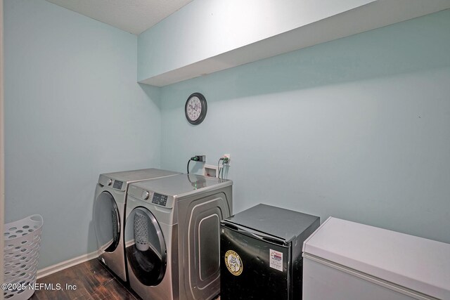 1341 River City St, Saint Augustine, FL 32092 - washroom featuring dark wood-style flooring and independent washer and dryer