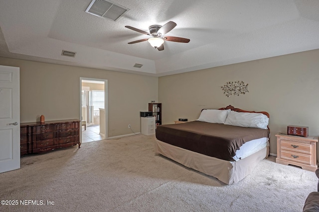 1341 River City St, Saint Augustine, FL 32092 - carpeted bedroom with a raised ceiling, ensuite bathroom, ceiling fan, and a textured ceiling