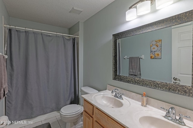 1341 River City St, Saint Augustine, FL 32092 - bathroom featuring double vanity, a textured ceiling, tile patterned flooring, and shower / bath combo with shower curtain