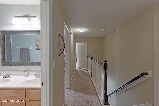 1341 River City St, Saint Augustine, FL 32092 - hall with an upstairs landing, carpet floors, and a textured ceiling
