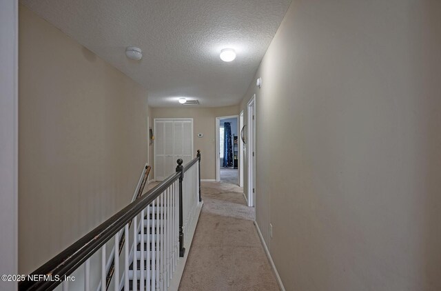 1341 River City St, Saint Augustine, FL 32092 - corridor with a textured ceiling and light carpet