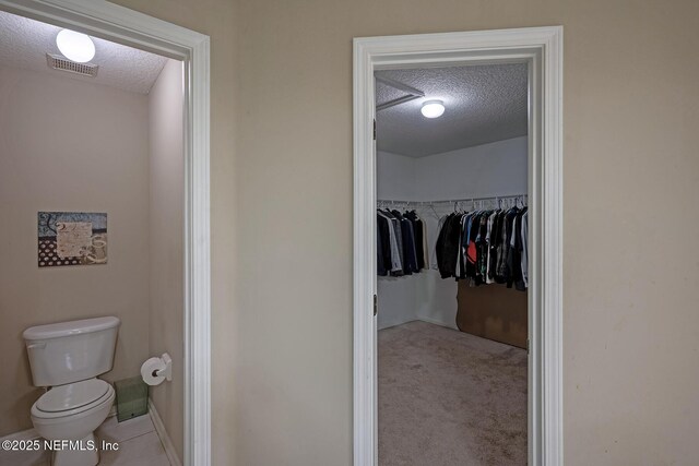 1341 River City St, Saint Augustine, FL 32092 - bathroom with a textured ceiling and a walk in closet