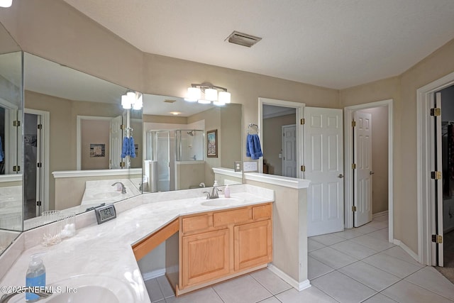 1341 River City St, Saint Augustine, FL 32092 - full bathroom featuring a spacious closet, a stall shower, double vanity, and tile patterned floors