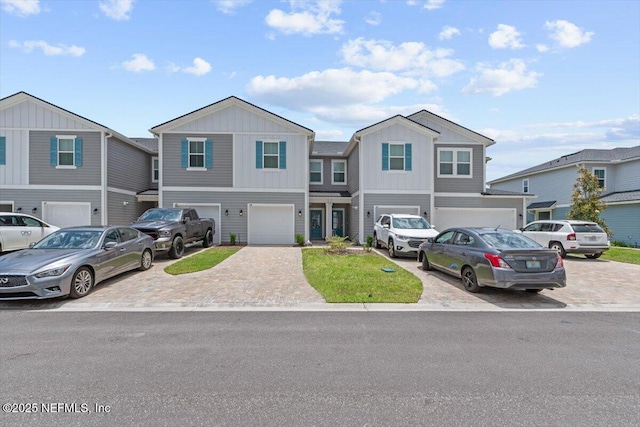 39 Thurnham Ln, Saint Augustine, FL 32092 - townhome / multi-family property featuring driveway, an attached garage, and board and batten siding