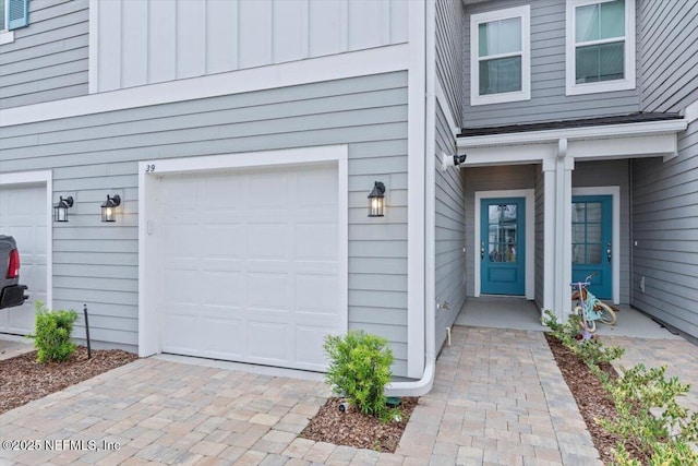 39 Thurnham Ln, Saint Augustine, FL 32092 - property entrance with a garage and board and batten siding