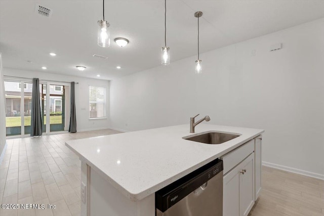 39 Thurnham Ln, Saint Augustine, FL 32092 - kitchen featuring stainless steel dishwasher, decorative light fixtures, open floor plan, white cabinets, and a center island with sink