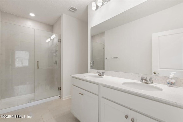 39 Thurnham Ln, Saint Augustine, FL 32092 - full bathroom with a shower stall, double vanity, and tile patterned flooring