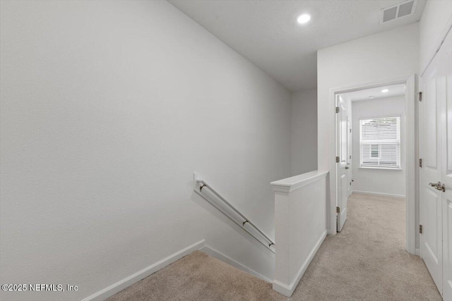 39 Thurnham Ln, Saint Augustine, FL 32092 - hallway featuring an upstairs landing, light colored carpet, and recessed lighting