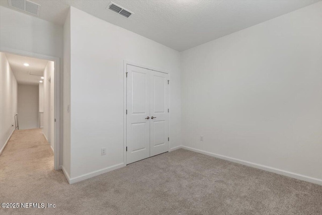 39 Thurnham Ln, Saint Augustine, FL 32092 - unfurnished bedroom with light colored carpet and a closet