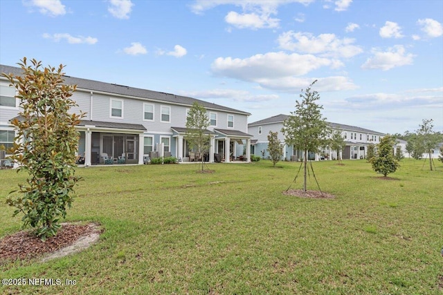 39 Thurnham Ln, Saint Augustine, FL 32092 - rear view of house with a pergola, a lawn, and a sunroom