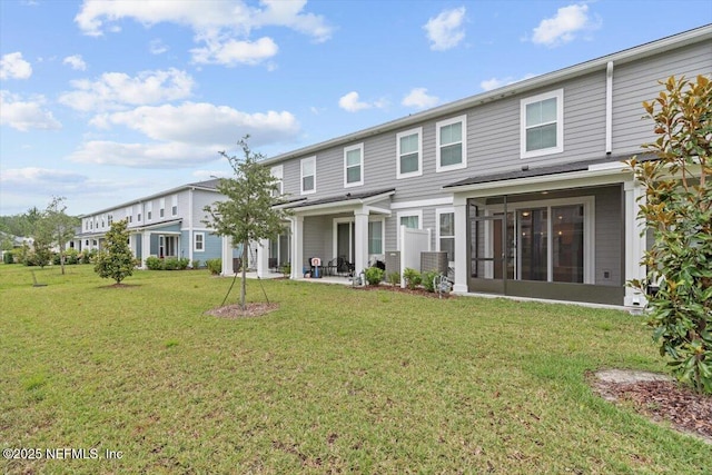 39 Thurnham Ln, Saint Augustine, FL 32092 - back of house with a lawn, a sunroom, and a patio