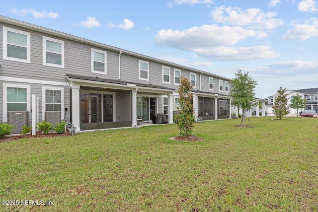 39 Thurnham Ln, Saint Augustine, FL 32092 - back of property with a sunroom and a lawn