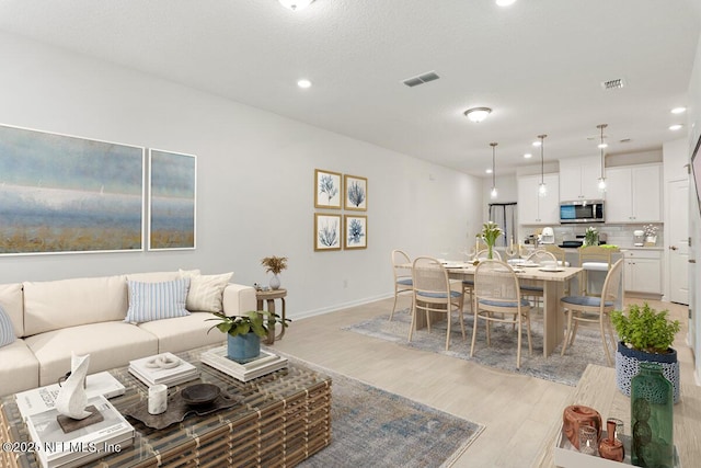 39 Thurnham Ln, Saint Augustine, FL 32092 - living room with light wood finished floors and recessed lighting