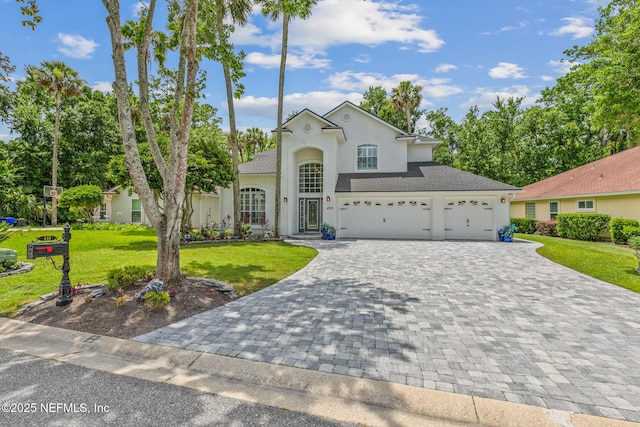 433 Big Tree Rd, Ponte Vedra Beach, FL 32082 - view of front of property featuring decorative driveway, stucco siding, a front lawn, and an attached garage