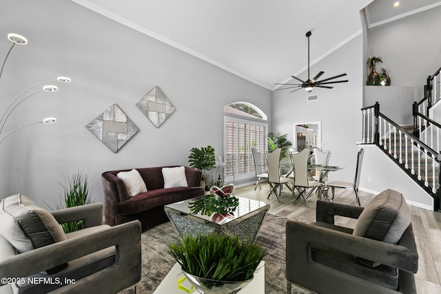 433 Big Tree Rd, Ponte Vedra Beach, FL 32082 - living area with high vaulted ceiling, ornamental molding, light wood-type flooring, ceiling fan, and stairs