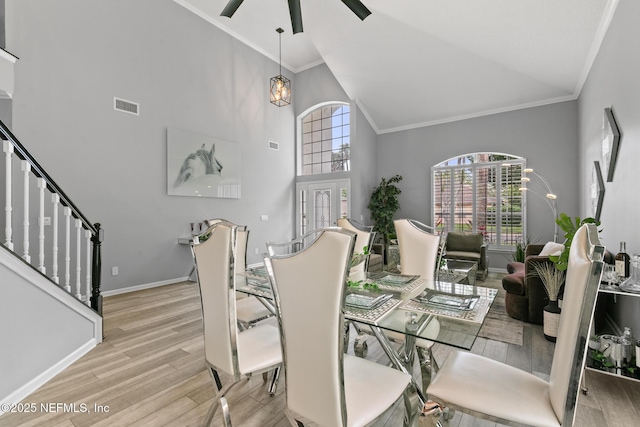 433 Big Tree Rd, Ponte Vedra Beach, FL 32082 - dining room featuring wood finished floors, stairway, high vaulted ceiling, crown molding, and a ceiling fan