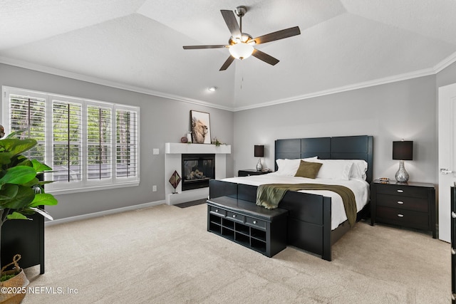 433 Big Tree Rd, Ponte Vedra Beach, FL 32082 - bedroom featuring ornamental molding, light carpet, lofted ceiling, a glass covered fireplace, and a ceiling fan