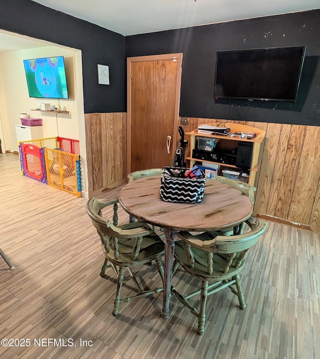 7505 Mayapple Rd, Jacksonville, FL 32211 - dining space with wood finished floors and wood walls
