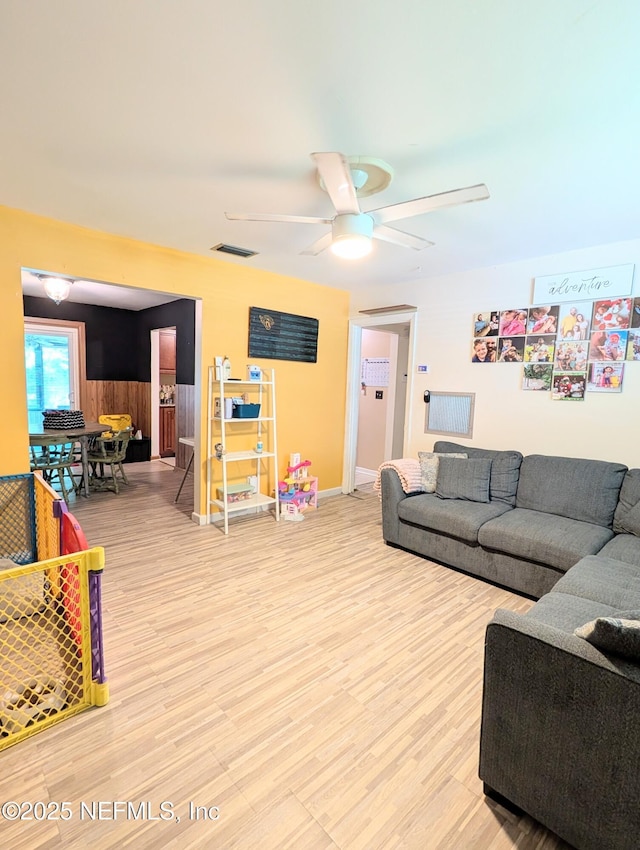 7505 Mayapple Rd, Jacksonville, FL 32211 - living room with light wood-style flooring and a ceiling fan