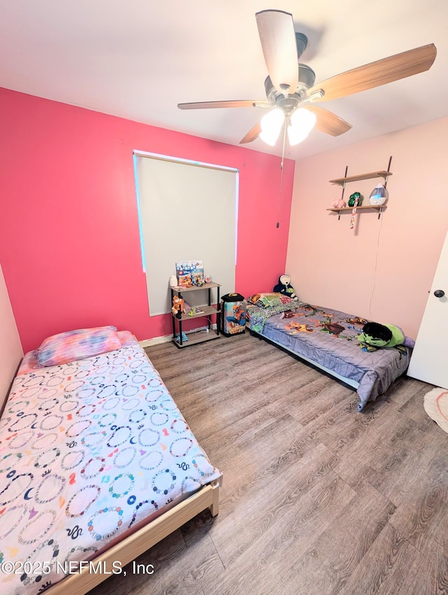 7505 Mayapple Rd, Jacksonville, FL 32211 - bedroom with wood finished floors and a ceiling fan
