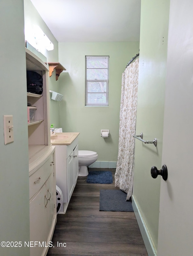 7505 Mayapple Rd, Jacksonville, FL 32211 - full bathroom with vanity, wood finished floors, and a shower with shower curtain