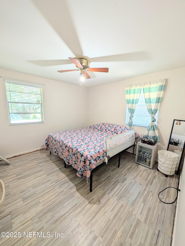7505 Mayapple Rd, Jacksonville, FL 32211 - bedroom featuring wood finished floors and a ceiling fan