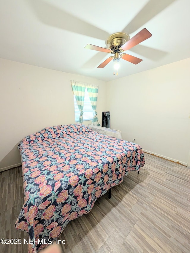 7505 Mayapple Rd, Jacksonville, FL 32211 - bedroom featuring wood finished floors and ceiling fan