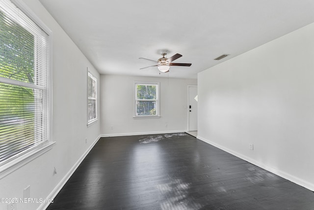 431 W 62nd St, Jacksonville, FL 32208 - empty room featuring a ceiling fan and dark wood-style floors