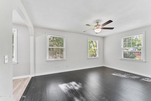 431 W 62nd St, Jacksonville, FL 32208 - spare room featuring wood finished floors and a ceiling fan
