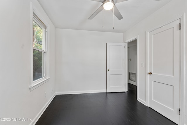 431 W 62nd St, Jacksonville, FL 32208 - spare room with dark wood-style flooring and ceiling fan