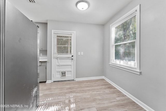 431 W 62nd St, Jacksonville, FL 32208 - doorway featuring plenty of natural light and light wood finished floors