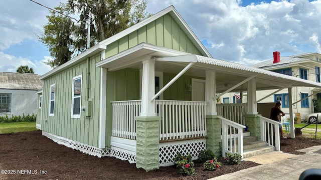 209 N 7th St, Palatka, FL 32177 - view of property exterior with board and batten siding and covered porch