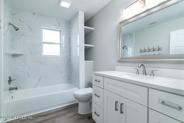 209 N 7th St, Palatka, FL 32177 - bathroom featuring vanity, wood finished floors, and shower / bath combination