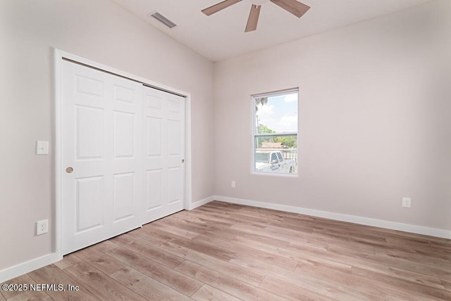 209 N 7th St, Palatka, FL 32177 - unfurnished bedroom featuring light wood-style flooring, a closet, and ceiling fan
