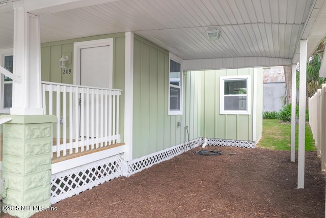 209 N 7th St, Palatka, FL 32177 - property entrance featuring board and batten siding