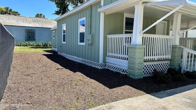 209 N 7th St, Palatka, FL 32177 - view of side of home with board and batten siding and covered porch