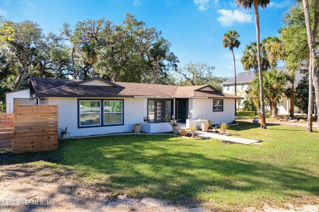 5062 N Ocean Shore Blvd, Palm Coast, FL 32137 - back of house featuring stucco siding and a shingled roof