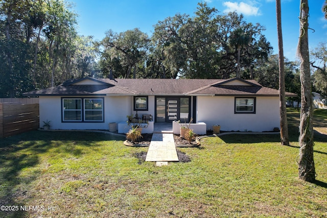 5062 N Ocean Shore Blvd, Palm Coast, FL 32137 - rear view of house featuring stucco siding, a patio area, and a shingled roof