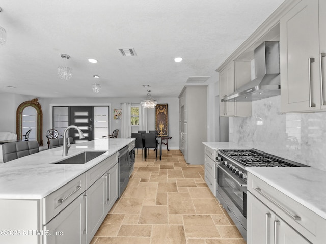 5062 N Ocean Shore Blvd, Palm Coast, FL 32137 - kitchen with wall chimney exhaust hood, appliances with stainless steel finishes, recessed lighting, stone tile floors, and tasteful backsplash