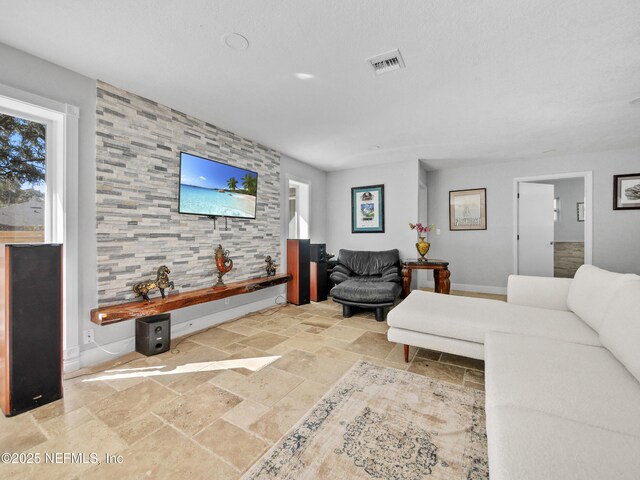 5062 N Ocean Shore Blvd, Palm Coast, FL 32137 - living room with stone tile flooring and baseboards