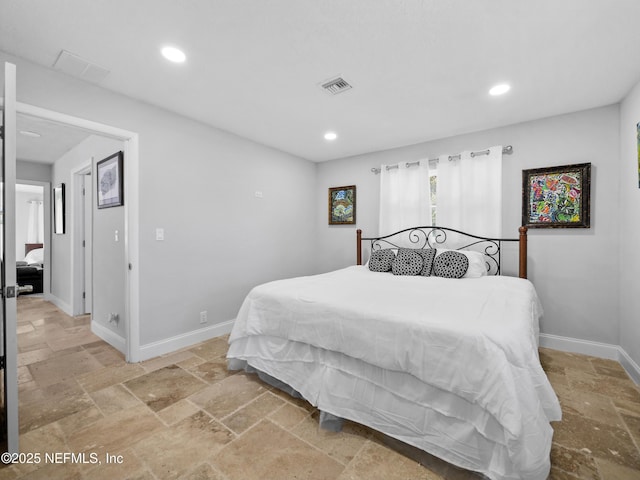5062 N Ocean Shore Blvd, Palm Coast, FL 32137 - bedroom with stone tile flooring and recessed lighting