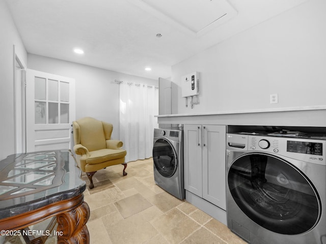 5062 N Ocean Shore Blvd, Palm Coast, FL 32137 - washroom featuring washer and clothes dryer, recessed lighting, stone tile flooring, and cabinet space