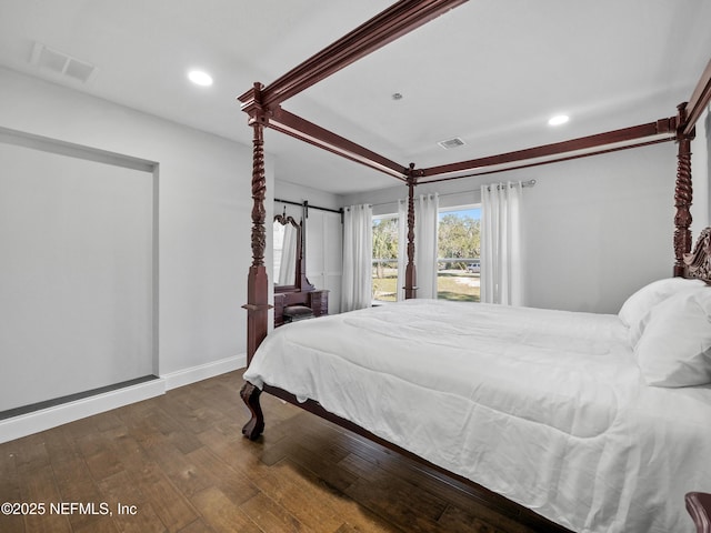 5062 N Ocean Shore Blvd, Palm Coast, FL 32137 - bedroom with wood-type flooring and recessed lighting