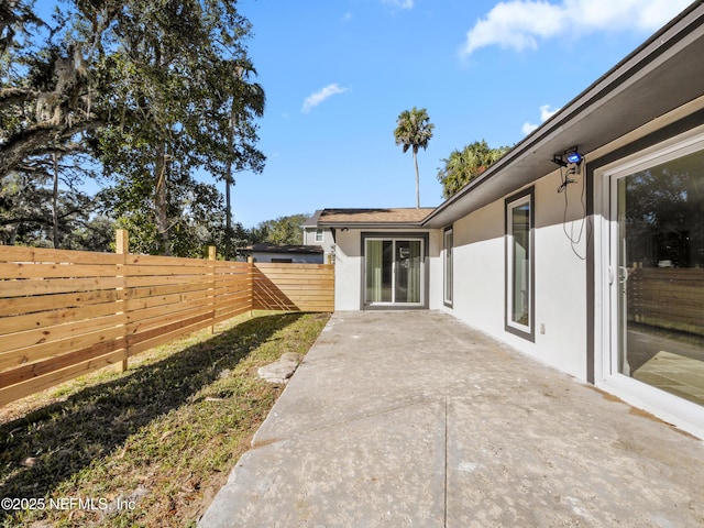 5062 N Ocean Shore Blvd, Palm Coast, FL 32137 - fenced backyard with a patio